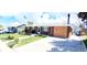 A charming brick home with well-maintained lawn and concrete driveway at 8338 Charles Way, Denver, CO 80221