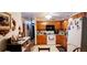 Functional kitchen featuring wood cabinets and essential appliances at 8338 Charles Way, Denver, CO 80221