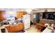 Bright kitchen with classic cabinetry and a cozy breakfast nook at 8338 Charles Way, Denver, CO 80221