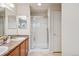 This primary bathroom has a shower and double sink vanity at 12827 W Burgundy Pl, Littleton, CO 80127