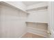 Walk-in closet provides ample storage with shelving and carpeted floor at 12827 W Burgundy Pl, Littleton, CO 80127
