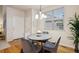 Charming dining area featuring a round table and comfortable seating for four at 12827 W Burgundy Pl, Littleton, CO 80127
