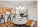Open dining area with seating for four, flowing seamlessly from the kitchen and living room at 12827 W Burgundy Pl, Littleton, CO 80127