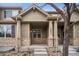 Inviting front entrance featuring stone accents and a covered porch for a warm welcome at 12827 W Burgundy Pl, Littleton, CO 80127