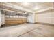 Spacious two car garage with concrete floors and drywall, perfect for parking and additional storage at 12827 W Burgundy Pl, Littleton, CO 80127