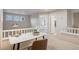 Loft features a desk near the bedrooms with neutral walls and carpet at 12827 W Burgundy Pl, Littleton, CO 80127