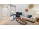 Bright living room with a cozy fireplace and neutral decor, perfect for relaxation at 12827 W Burgundy Pl, Littleton, CO 80127