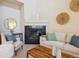 Inviting living room with a cozy fireplace, comfortable seating, and stylish decor at 12827 W Burgundy Pl, Littleton, CO 80127