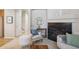 Comfortable living room with fireplace, neutral walls, and cozy seating arrangement at 12827 W Burgundy Pl, Littleton, CO 80127