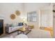 Bright living room with a modern fireplace, comfortable seating, and stylish decor at 12827 W Burgundy Pl, Littleton, CO 80127