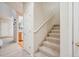 Carpeted staircase leading to the upper level of the home at 12827 W Burgundy Pl, Littleton, CO 80127