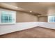 Finished basement with neutral walls and carpet at 9441 Wolfe St, Highlands Ranch, CO 80129