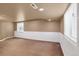 Spacious finished basement with neutral carpeting and large windows at 9441 Wolfe St, Highlands Ranch, CO 80129