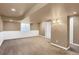 Finished basement with neutral walls and carpet at 9441 Wolfe St, Highlands Ranch, CO 80129
