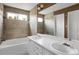 Bathroom boasts double sinks, a bathtub, and tile flooring at 9441 Wolfe St, Highlands Ranch, CO 80129