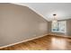 Bright dining room with hardwood floors, large window, and neutral walls at 9441 Wolfe St, Highlands Ranch, CO 80129