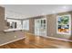 Light-filled dining area with hardwood floors and kitchen access at 9441 Wolfe St, Highlands Ranch, CO 80129