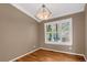 Dining room with hardwood floors, plantation shutters, and chandelier at 9441 Wolfe St, Highlands Ranch, CO 80129
