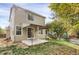 Back exterior view of house, showing patio and yard at 9441 Wolfe St, Highlands Ranch, CO 80129