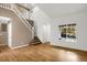 Spacious living room with hardwood floors, high ceilings and staircase at 9441 Wolfe St, Highlands Ranch, CO 80129