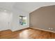 Living room with hardwood floors, large window and neutral walls at 9441 Wolfe St, Highlands Ranch, CO 80129
