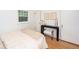 Bright bedroom featuring hardwood floors and a minimalist design at 5680 W 41St Ave, Wheat Ridge, CO 80212