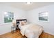 Bright bedroom with hardwood floors and two windows at 5680 W 41St Ave, Wheat Ridge, CO 80212