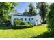 Charming home featuring a well-manicured lawn and unique shrubbery at 5680 W 41St Ave, Wheat Ridge, CO 80212