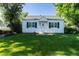 Charming home with a well-manicured lawn and mature trees at 5680 W 41St Ave, Wheat Ridge, CO 80212