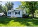 Charming home with a well-manicured lawn and mature trees at 5680 W 41St Ave, Wheat Ridge, CO 80212