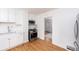 Bright kitchen featuring stainless steel appliances, quartz countertops, and wood flooring at 5680 W 41St Ave, Wheat Ridge, CO 80212