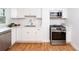 Bright kitchen featuring stainless steel appliances, quartz countertops, and wood flooring at 5680 W 41St Ave, Wheat Ridge, CO 80212