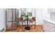 Bright kitchen featuring stainless steel appliances, quartz countertops, and wood flooring at 5680 W 41St Ave, Wheat Ridge, CO 80212