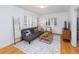 Cozy living room features hardwood floors and lots of natural light at 5680 W 41St Ave, Wheat Ridge, CO 80212
