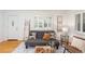 Cozy living room features hardwood floors and lots of natural light at 5680 W 41St Ave, Wheat Ridge, CO 80212