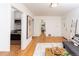 Open living room flows into the kitchen with hardwood floors at 5680 W 41St Ave, Wheat Ridge, CO 80212