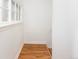 Utility room with window, hardwood floor and a small hatch at 5680 W 41St Ave, Wheat Ridge, CO 80212