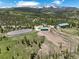 Expansive equestrian property featuring an outdoor riding arena and stable complex, set amidst picturesque scenery at 300 Gold Hill Rd, Breckenridge, CO 80424