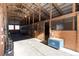 View of the barn interior featuring multiple stalls with wooden framing and metal bars for secure horse housing at 300 Gold Hill Rd, Breckenridge, CO 80424