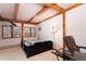 Bright bedroom features wood beam ceiling, two windows, and neutral carpet at 300 Gold Hill Rd, Breckenridge, CO 80424