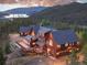 Beautiful home featuring a spacious deck, garage, and picturesque views of the surrounding landscape at 300 Gold Hill Rd, Breckenridge, CO 80424