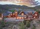 Sprawling mountain home with expansive deck, blending seamlessly with the natural surroundings and offering breathtaking views at 300 Gold Hill Rd, Breckenridge, CO 80424