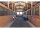 Well-maintained horse stalls with wood construction and open ceilings for excellent ventilation at 300 Gold Hill Rd, Breckenridge, CO 80424