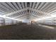 Large indoor horse arena with groomed dirt and a metal ceiling at 300 Gold Hill Rd, Breckenridge, CO 80424