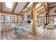 Lovely kitchen with rustic cabinets, countertops, stainless steel appliances, and exposed wooden beams at 300 Gold Hill Rd, Breckenridge, CO 80424