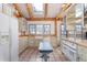 Bright kitchen with wood countertops, rustic cabinets, stainless steel appliances, and exposed wooden beams at 300 Gold Hill Rd, Breckenridge, CO 80424