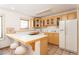 This kitchenette includes cabinets, countertop seating, and tile flooring at 300 Gold Hill Rd, Breckenridge, CO 80424
