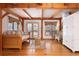 Cozy living room with wood beam details, natural light, a comfortable sofa and a decorative white hutch at 300 Gold Hill Rd, Breckenridge, CO 80424