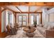 Cozy living room with wooden beams, rustic coffee table, comfortable seating, and natural light at 300 Gold Hill Rd, Breckenridge, CO 80424