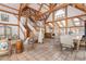 Expansive living space boasting an open floor plan, wooden beams, and beautiful tile flooring at 300 Gold Hill Rd, Breckenridge, CO 80424